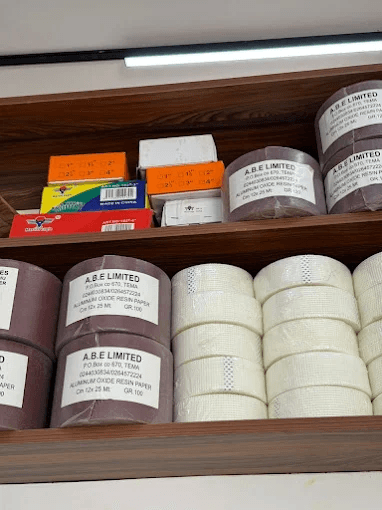 A.B.E abrasive paper rolls and mesh tape on shop shelves